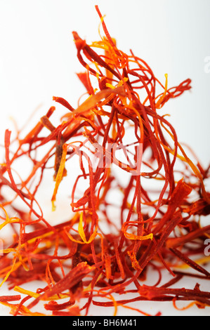 Stock photo of saffron strands on a white background.