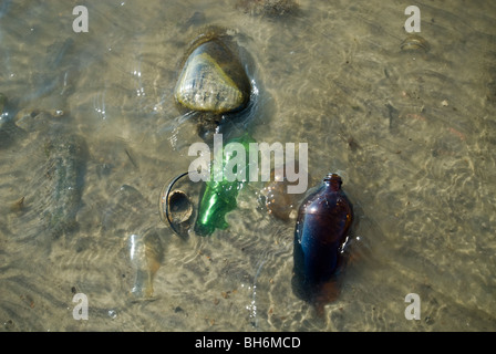 Debris and artifacts wash up on the beach of Barren Island in Dead Horse Bay in the Gateway National Recreation Area in New York Stock Photo