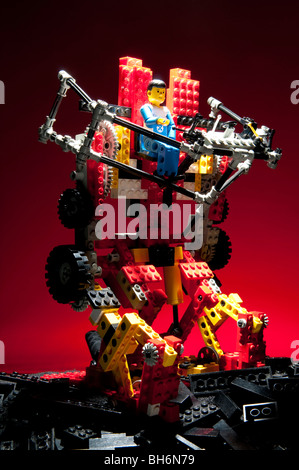 Lego Robot Standing On Mound Of Black Lego Stock Photo