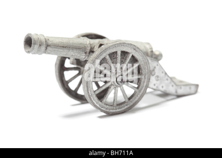 Old metallic toy cannon isolated on white Stock Photo