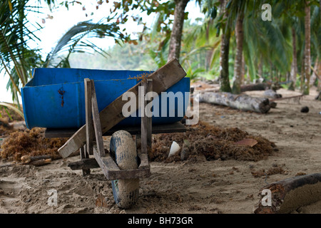 A work man's wheelbarrow on the beach at Punta Uva in Costa Rica Stock Photo