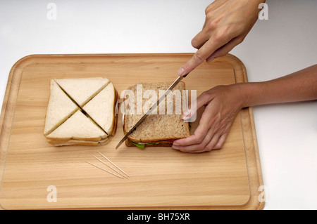 Cutting sandwiches Stock Photo