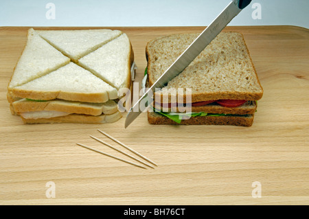 Cutting sandwiches Stock Photo