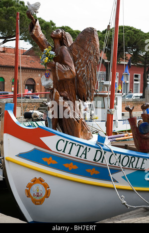 Fishing boats at the head of the canal at Caorle in the Veneto Italy Stock Photo