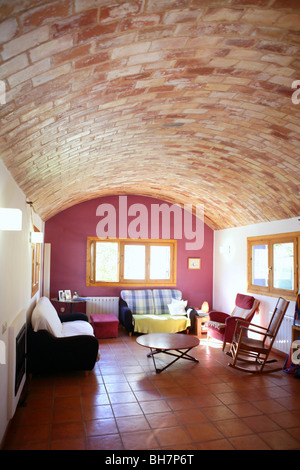 Nice living room with barrel vault on clay bricks, Mediterranean interior house Stock Photo
