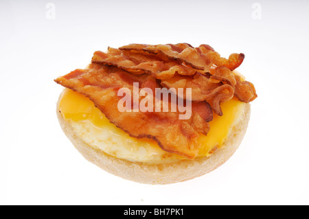 Open bacon, fried egg and cheese on english muffin breakfast sandwich cut out. Stock Photo