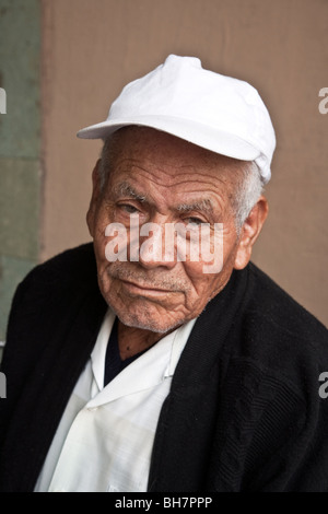 portrait of an immaculate old Mexican man with a rueful expression stubble beard & deeply furrowed brow Oaxaca City Mexico Stock Photo