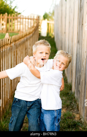 brothers playing around Stock Photo