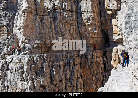 Climbers on the via ferrata Bochette Centrali in the Brenta Dolomite mountains, Italy. Stock Photo