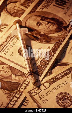 syringe on American money Stock Photo