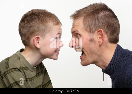 closeup of father and child making funny faces at each other Stock Photo