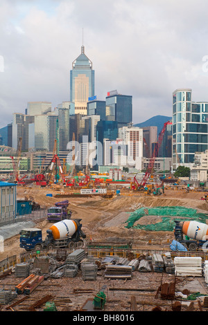 Major reclamation works in progress in Victoria Harbour with highrise buildings to rear in Central District, Hong Kong, China Stock Photo