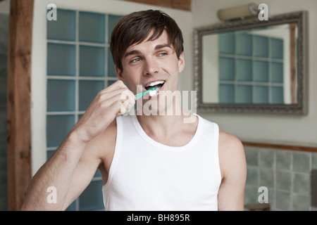 A man brushing his teeth Stock Photo