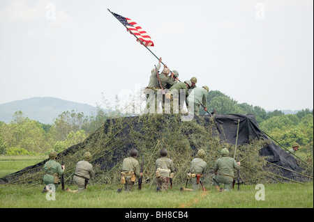 A World War II reenactment of US Marines raising the American flag on Iwo Jima on February 23, 1945 at Mid-Atlantic Air Museum Stock Photo