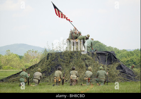 A World War II reenactment of US Marines raising the American flag on Iwo Jima on February 23, 1945 at Mid-Atlantic Air Museum Stock Photo