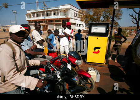 People queue for fuel at a service station in Menongue, Angola, Africa. Stock Photo