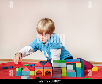 boy with toy building blocks Stock Photo