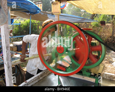 India.Street Vendor Selling Freshly Squeezed Sugarcane in Goa Stock Photo