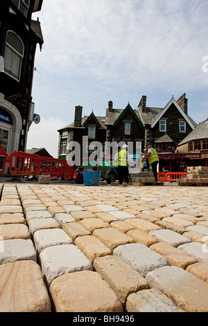 Modern cobblestone being laid Stock Photo