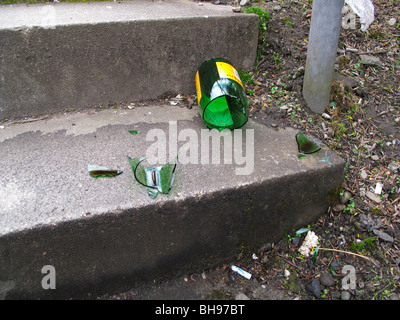 Broken wine bottle on concrete steps Stock Photo