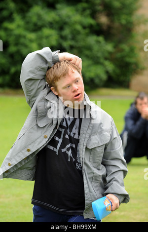 Young man with learning disabilities plays cricket, as part of a Sport Ability Day North Yorkshire. Stock Photo