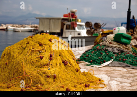 green blue fishing net with floating buoys and thick white ropes