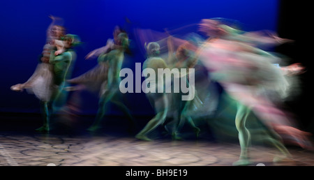 Blurred Cinderella and Fairy Godmother dancing with green fairies in Ballet Jorgen stage production Toronto Stock Photo