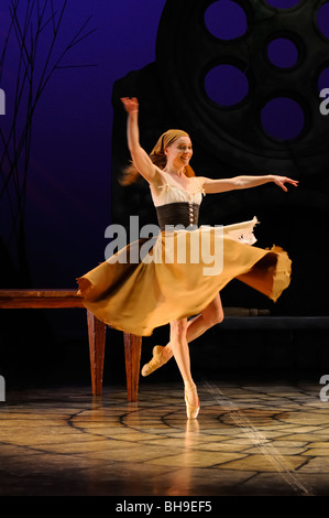 Cinderella at home in rags en pointe with one shoe after the Ball dancing solo in Ballet Jorgen stage production Toronto Stock Photo