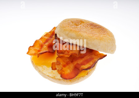 Bacon fried egg and cheese on english muffin breakfast sandwich cut out. Stock Photo