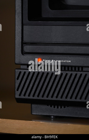 Electrical equipment on standby. The red lights indicate standby modes. Stock Photo