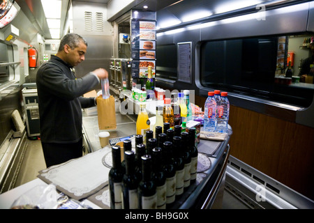 Display of drink / wine bottles in the buffet carriage on the Eurostar train to Paris, France. Stock Photo