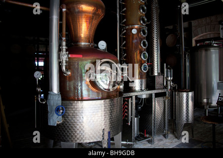 A working steam powered rum distillery at St Nicholas Abbey on the Caribbean island of Barbados Stock Photo