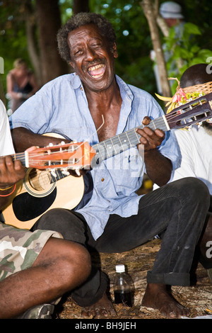 A Ghizo Island string band performs for visiting passengers from Aussie expedition cruiser Orion at nearby Kennedy Island Stock Photo