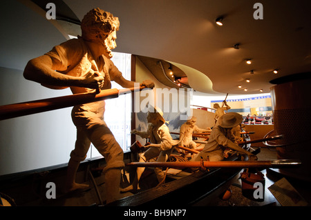 SYDNEY, Australia — A nautical explorer exhibit at the Australian National Maritime Museum in Sydney, Australia. The Australian National Maritime Museum stands prominently along the waterfront of Darling Harbour. The museum's distinctive white roof and modern architecture contrast with the historic vessels moored alongside, including the replica of Captain Cook's HMB Endeavour. Stock Photo