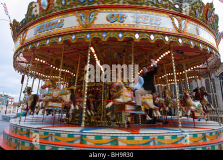 The Pride of the South Galloping Horses carousel ride working in Nowich. Stock Photo