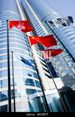 The Hong Kong and Peoples Republic of China's flags flying outside Exchange Square in Central, Hong Kong. Stock Photo