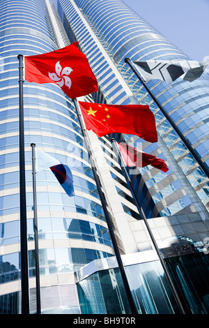 The Hong Kong and Peoples Republic of China's flags flying outside Exchange Square in Central, Hong Kong. Stock Photo