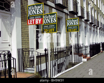 a row of properties in Worthing West Sussex with to let & let by boards Stock Photo