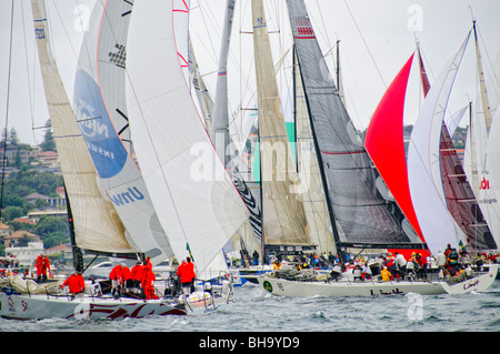 Rolex Sydney To Hobart Yacht Race Sydney Australia // SYDNEY, Australia — A downwind spinnaker start for the 100-stong fleet of the 2009 Rolex Sydney to Harbour Yacht Race in Sydney Harbour. Stock Photo