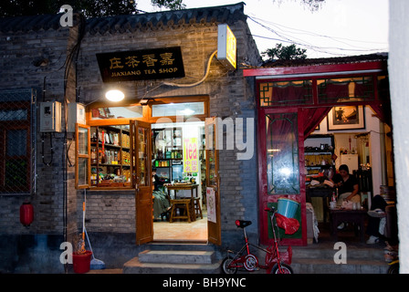 Beijing, CHINA- Old Traditional Hutong Neighborhood, Lit up at Night, Chinese Tea Shop, Shopfront Stock Photo