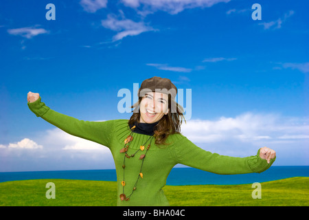 Beautiful happy woman smiling with a beautiful landscape on the back Stock Photo