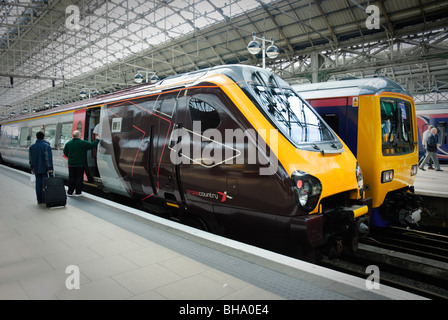 Passengers board a long-distance express train. Stock Photo