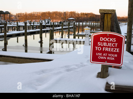 Snow covered docks at a Potomac River marina in Prince William County Virginia. Stock Photo