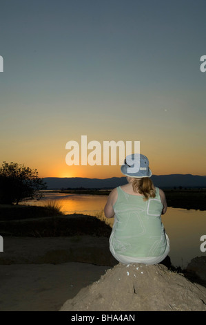 Tourists enjoy the multitude of views over the Zambezi River in Zimbabwe's Mana Pools National Park. Stock Photo