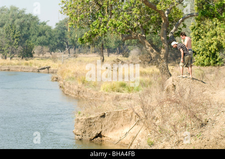 Tourists enjoy the multitude of views over the Zambezi River in Zimbabwe's Mana Pools National Park. Stock Photo