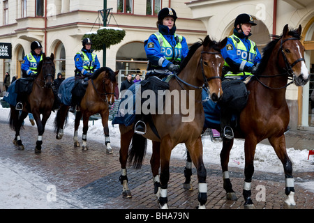 Four Swedish police sitting on horseback Stock Photo