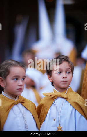 children in the Semana Santa procession in Vera Malaga, Andalucia, Spain Stock Photo