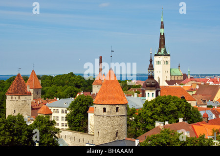 The 124m tall spire of Oleviste kirik (St Olav’s church) dominates the rooftops of Tallinn’s Old Town, view from Toompea Stock Photo