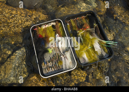 Still life of a fly fisherman's fly box on rocks in Montana Creek, Alaska Stock Photo