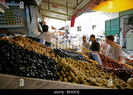 Olives for sale at a produce stall along one of the many narrow alleys at the casbah in Tetuon, Morocco Stock Photo